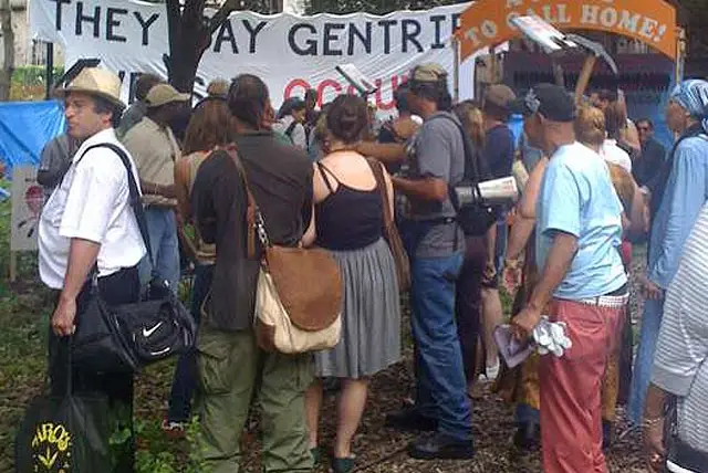 The banner reads, "THEY SAY GENTRIFY, WE SAY OCCUPY." Courtesy Picture the Homeless